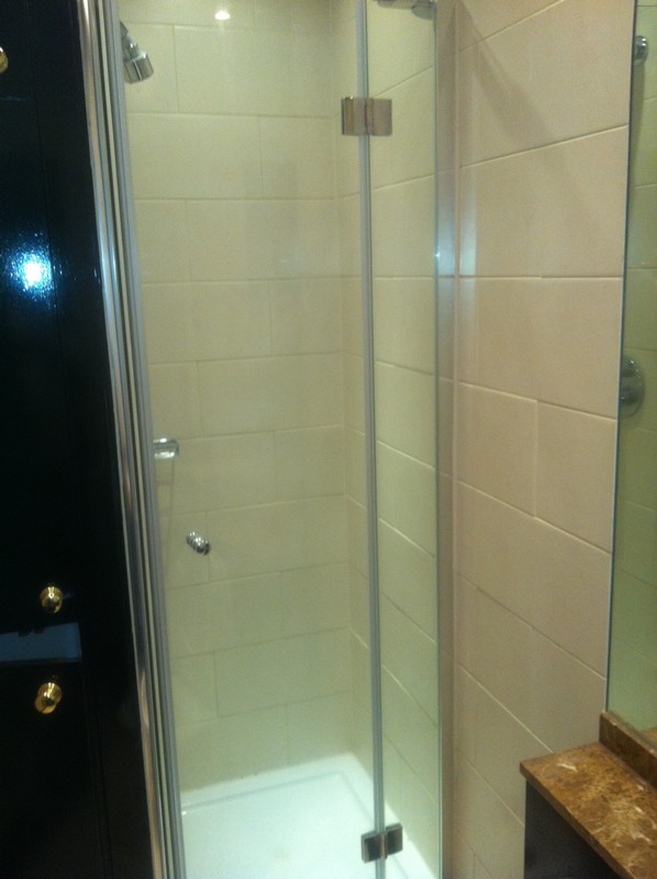 Frameless glass shower enclosure with chrome fittings in Hackney